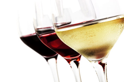 Three wine glasses over white background.  White wine, rose, and red.